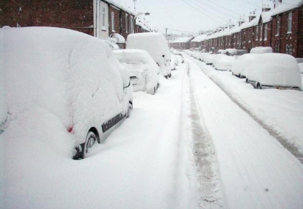 Cars covered in snow on a Chesterfield street in 2010.