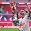 Jordan Clark celebrates winning the Vertu Trophy on Sunday - pic: David Horn / PRiME Media Images
