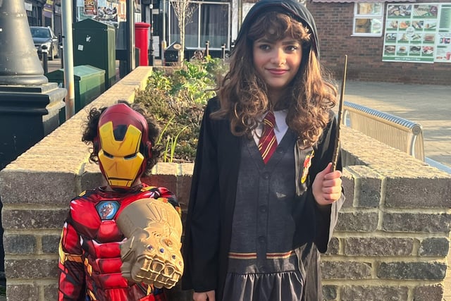 Pictured are Destiny, aged 11, dressed as Hermione from Harry Potter; and Devonte, seven, dressed as Iron Man