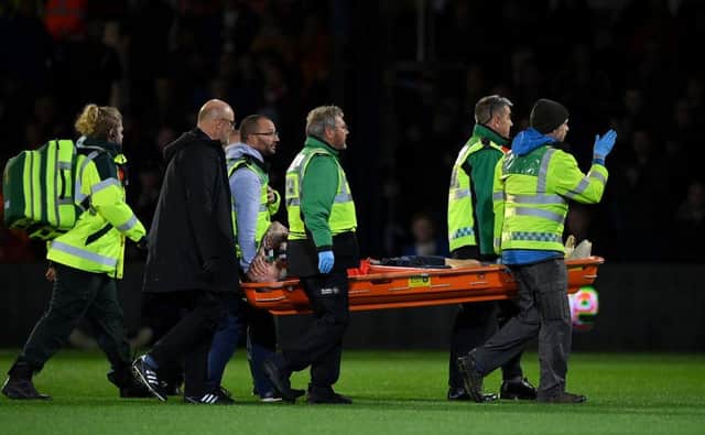 Sonny Bradley is stretchered off against Reading on Tuesday night