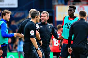 Luton manager Nathan Jones has words with referee Graham Scott after Luton's 0-0 draw against Birmingham City