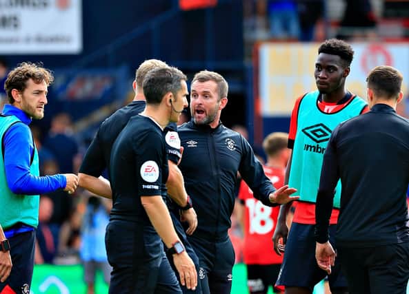 Luton manager Nathan Jones has words with referee Graham Scott after Luton's 0-0 draw against Birmingham City