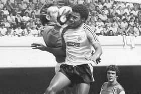 Former Town defender Paul Elliott goes up for a header during his time with Luton - pic: Hatters Heritage