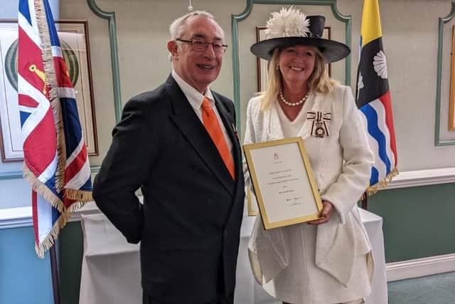 Gordon Gray was presented with the BEM by Susan Lousada, Lord Lieutenant of Bedfordshire