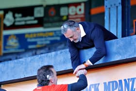 Hatters CEO Gary Sweet shakes hands with a Luton supporter at Kenilworth Road on Sunday - pic: Liam Smith