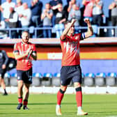 Town defender Dan Potts celebrates a recent victory for the Hatters