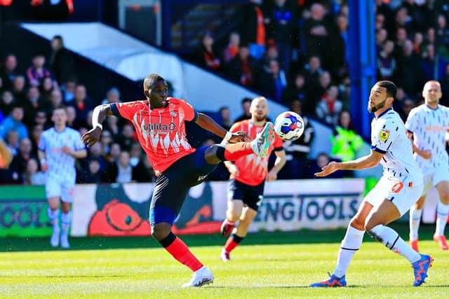 Marvelous Nakamba looks to win the ball against Blackpool
