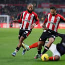 Chiedozie Ogbene tries to make a challenge on Brentford's Saman Ghoddos this afternoon - pic: Richard Heathcote/Getty Images