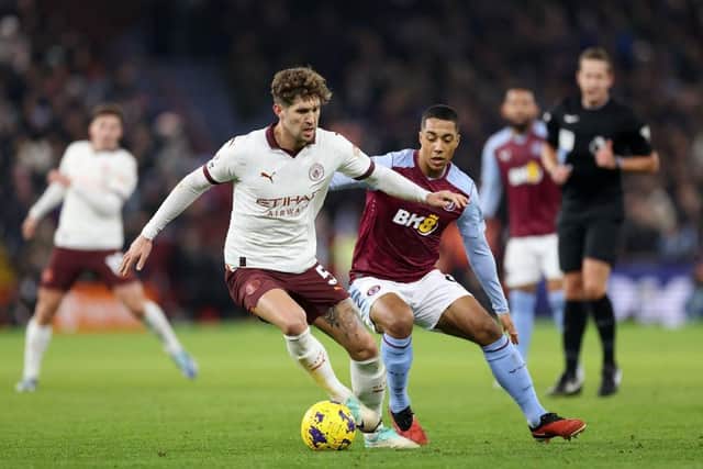 Manchester City defender John Stones under pressure from Aston Villa's Youri Tielemans on Tuesday night - pic: Catherine Ivill/Getty Images