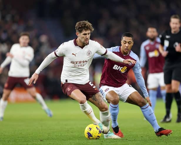 Manchester City defender John Stones under pressure from Aston Villa's Youri Tielemans on Tuesday night - pic: Catherine Ivill/Getty Images