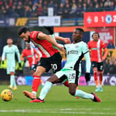 Town attacker Andros Townsend looks to get away from Chelsea midfielder Moises Caicedo - pic: Liam Smith