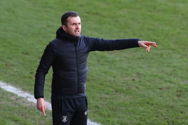 Nathan Jones, manager of Luton Town, gives their team instructions during the Sky Bet Championship match between Luton Town and Sheffield Wednesday at Kenilworth Road on February 27, 2021.