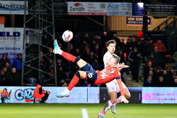 Cauley Woodrow clears his lines against Cardiff on Tuesday night