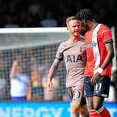 Elijah Adebayo exchanges words with Spurs midfielder James Maddison - pic: Liam Smith