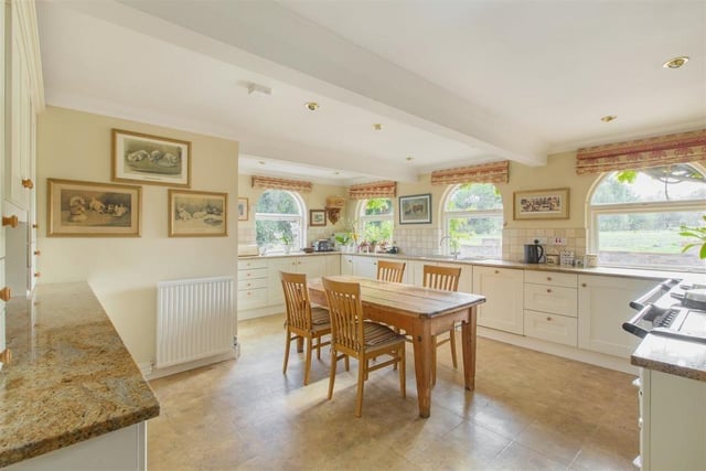With impressive views of the garden, the kitchen, complete with an AGA, has enough room for an island - should the new owners want to update.