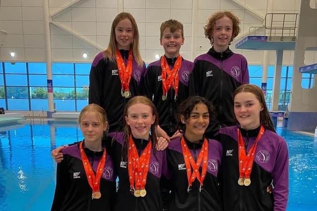 Luton Diving Club members show off their fine array of medals
