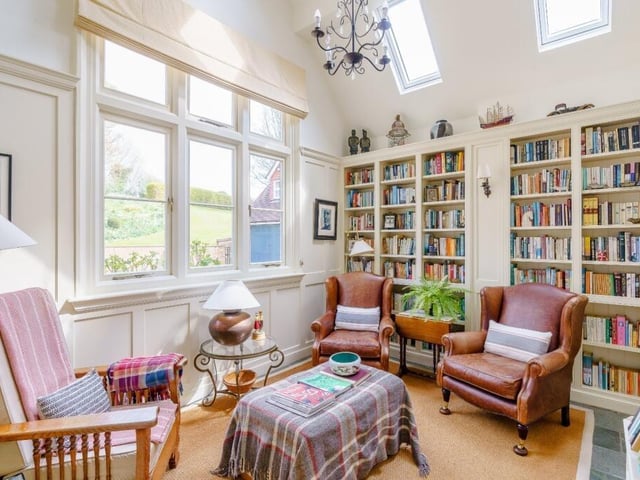 Book lovers: Imagine yourself curled up in a comfy chair in your own personal library! That could be a reality with this home.
