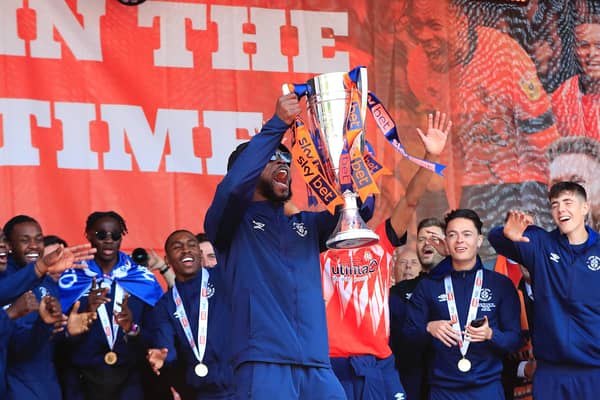 Fred Onyedinma celebrates with the Championship play-off winners' trophy