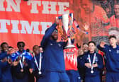 Fred Onyedinma celebrates with the Championship play-off winners' trophy