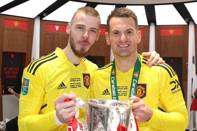 Manchester United keeper Tom Heaton with David de Gea after the Red Devils' Carabao Cup Final win over Newcastle