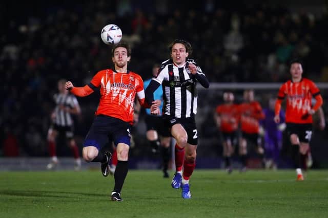 Tom Lockyer looks to win the ball at Grimsby on Tuesday night