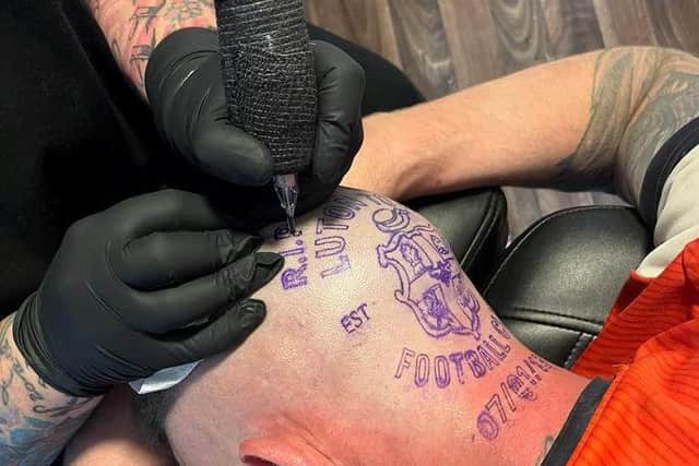 Micky Hyde getting his Luton Town head tattoo.