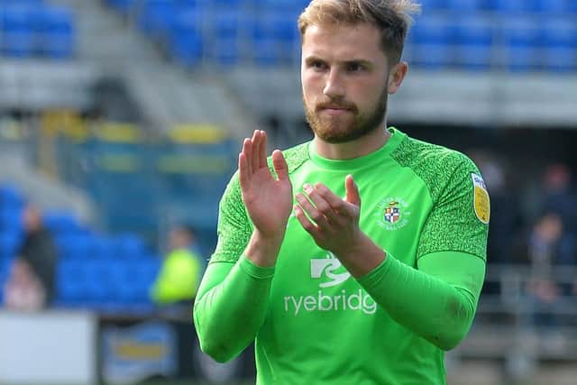 Town keeper Harry Isted applauds the visiting fans after Luton's 1-0 win at Cardiff on Monday - pic: Gareth Owen