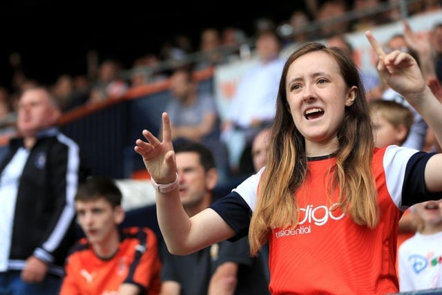 A Luton Town fan cheers their team during the Sky Bet Championship match between Luton Town and Huddersfield Town at Kenilworth Road on August 31, 2019.