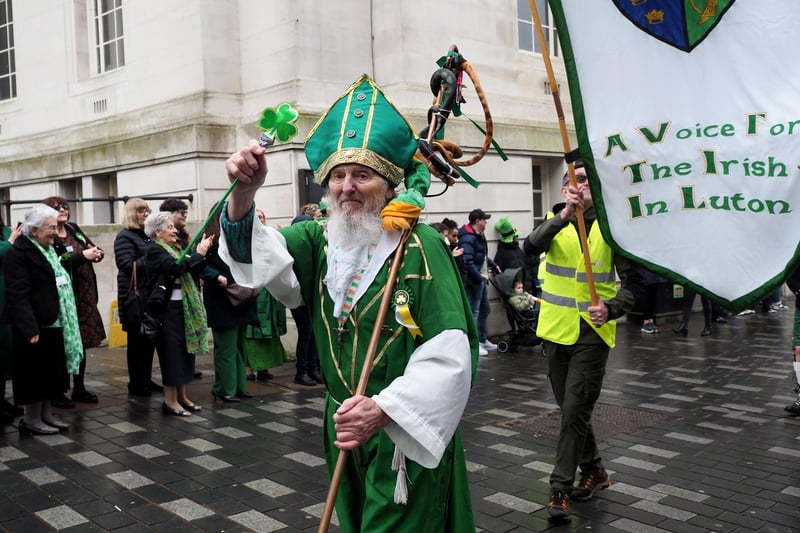 A St Patrick lookalike led the parade past the town hall.