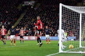 Sheffield United's Max Lowe can only watch as Carlton Morris's cross deflects off Anis Slimane and nestles into the net for Luton Town's winning goal - pic: George Wood/Getty Images