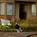 Two young boys play football in the street, September 30, 2008 in the Govan area of Glasgow. Photo by Jeff J Mitchell/Getty Images