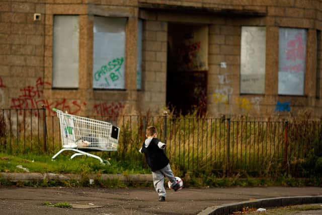 Two young boys play football in the street, September 30, 2008 in the Govan area of Glasgow. Photo by Jeff J Mitchell/Getty Images
