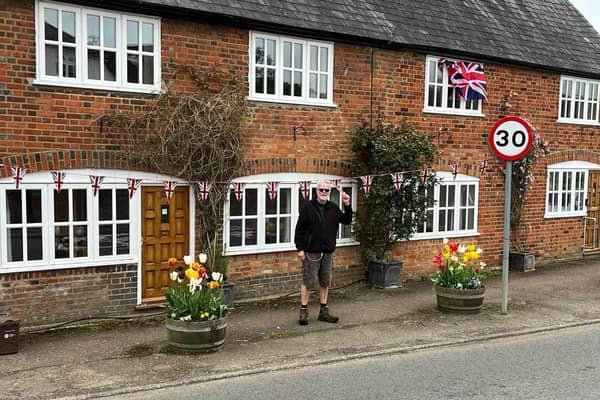 John outside the former Post Office in the village. Picture: John Hanna