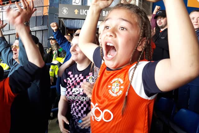 Eight year old Town fan Callum MacDonald from Caddington celebrates at Kenilworth Road