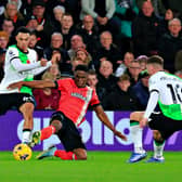 Chiedozie Ogbene slides in to try and win the ball back from Liverpool midfielder Trent Alexander-Arnold - pic: Liam Smith