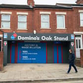A sign is installed at Luton Town F.C.’s Oak Stand entrance to the Kenilworth Road Stadium in Luton, renaming it as ‘The Domino’s Oak Stand. Picture: Simon Jacobs/PA Wire