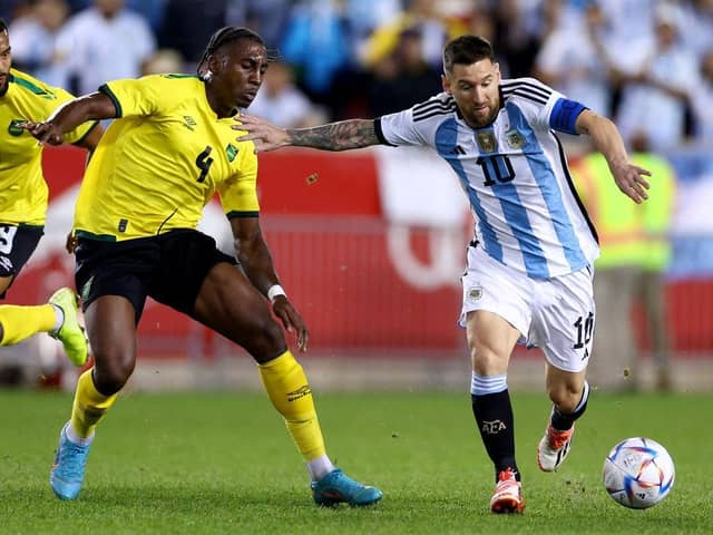 Luton defender Amari'i Bell in action for Jamaica against Argentina's Lionel Messi
