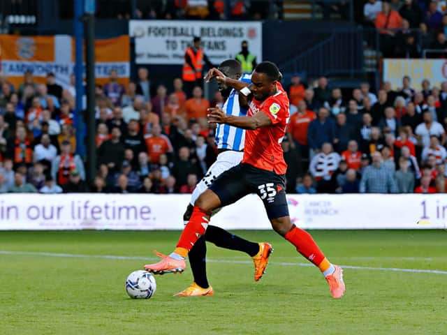 Cameron Jerome is about to be felled by Huddersfield defender Naby Sarr