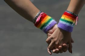 TEL AVIV, ISRAEL - JUNE 8:  A lesbian couple hold hands during the annual Gay Pride rally, on June 8, 2007 Tel Aviv, Israel's most cosmopolitan city. Thousands of alternative lifestyle Israelis took advantage of the mild summer weather to celebrate sexual freedom amidst calls from Jewish, Muslim and Christian religious leaders to ban a similar rally in Jerusalem later this month. (Photo by David Silverman/Getty Images)