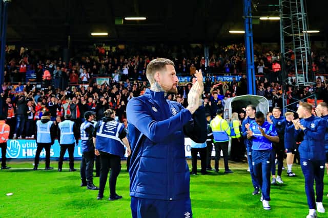 Sonny Bradley applauds the Luton supporters after beating Sunderland