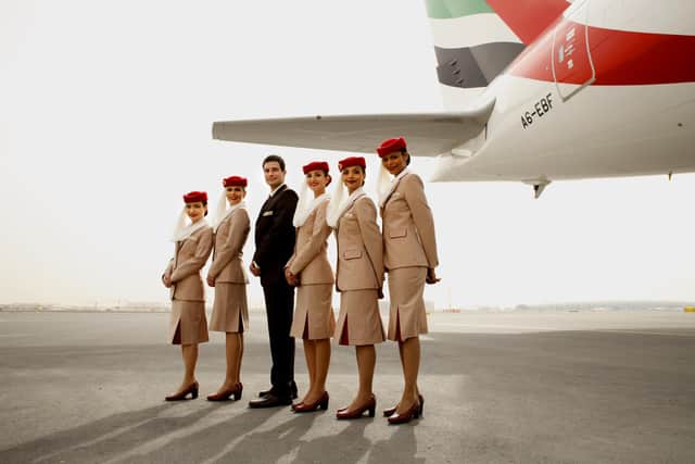 Pictured: Emirates cabin crew in front of plane