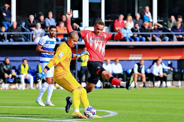 Carlton Morris pressurises QPR keeper Seny Dieng on Saturday