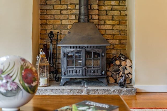 Can we please take a minute to look at this gorgeous log burner in the family and dining room? This would this be for entertaining in the colder months!