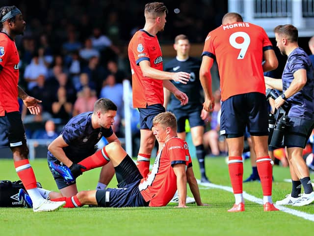 Mads Andersen receives treatment for a hamstring injury against Spurs earlier in the season - pic: Liam Smith