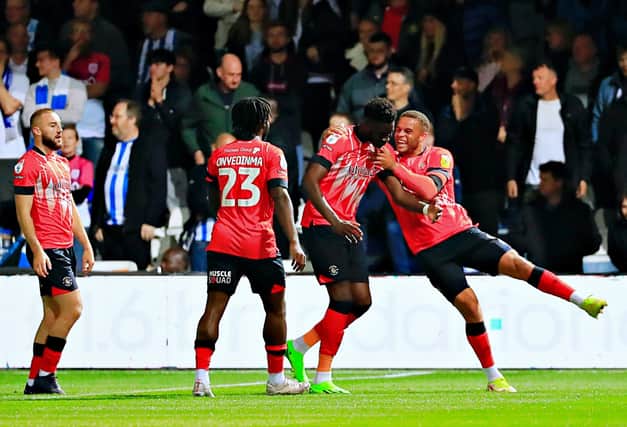 Elijah Adebayo celebrates his first goal against Huddersfield with strike partner Carlton Morris