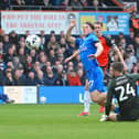 Josh Keeley is deemed guilty to have tripped Peterborough's Harry Leonard on Good Friday - pic: Andy Fitzsimons