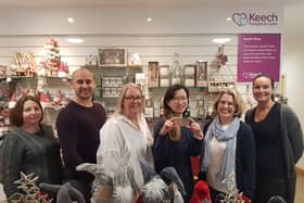 Staff at Keech Hospice Care shop celebrate the launch of the first nationally accepted multi retailer gift card to be spent exclusively in charity shops