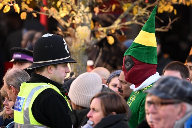 Luton's Deadpool - dressed as a Christmas elf - among the crowd waiting to greet King Charles (Photo by Leon Neal/Getty Images)
