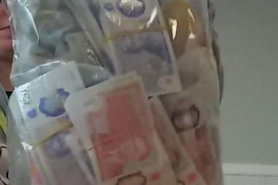 Some of the cash uncovered in a raid on his house