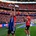 Sonny Bradley applauds the Hatters fans at Wembley